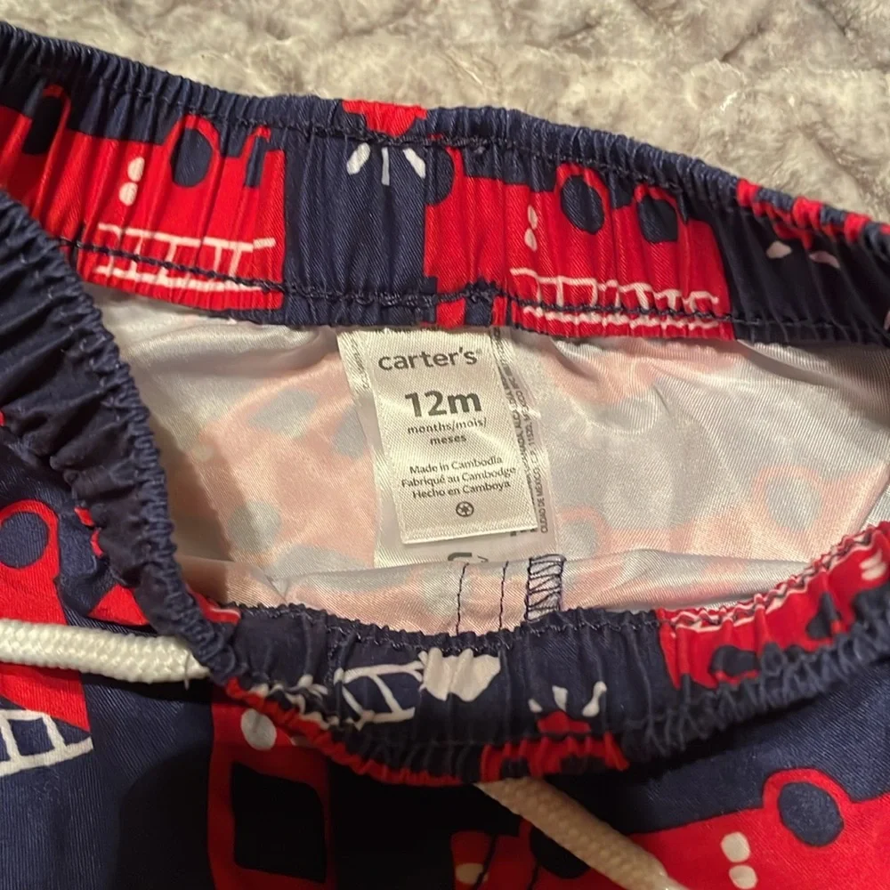 Carter’s~2 Boys Swim Shorts in Red, White and Blue. Elastic Waistband Size:12M